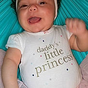 Neziah is registered to the contest to win money with this photo: baby, child, smiling, pink_bow, onesie, tutu, happy, cute, infant, portrait, sitting, clothing, headband, toddler, face, human, joyful, colorful_background, celebration, cheerful