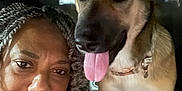 Luna is registered to the contest to win money with this photo: woman, dog, car_interior, selfie, smiling, braided_hair, tongue_out, pet, companion, friendship, seat, collar, portrait, indoor, closeup, face, canine, human, happy, together