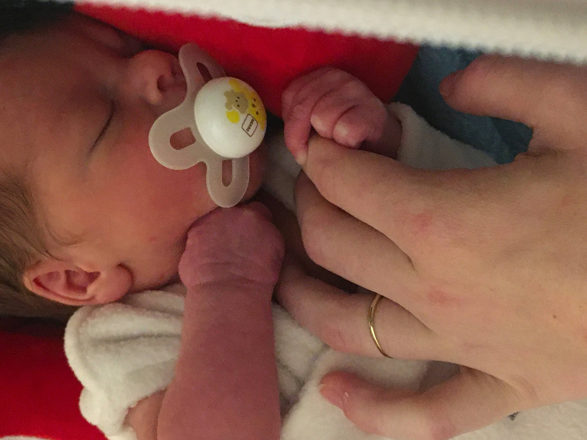 Liam is registered to the contest to win money with this photo: baby, baby_bottle, baby_products, baby_toddler_clothing, cheek, close_up, drinkware, ear, eyelash, facial_expression, finger, gesture, hand, human_body, mouth, nail, nose, person, skin, thumb