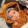 Layan participe au concours pour gagner de l'argent avec cette photo : baby, blanket, bodypart, bonnet, cap, clothing, face, finger, hand, hat, head, hood, hoodie, knitwear, person, photography, portrait, sweater, sweatshirt, towel