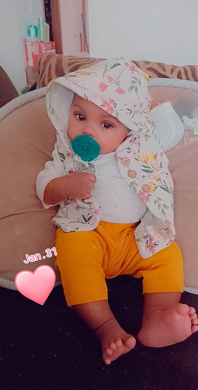 Jay'Lin joined the competition — help win amazing prizes! baby, baby_toddler_clothing, balloon, cap, cheek, child, comfort, eye, happy, head, headgear, headwear, human_leg, mouth, pattern, person, pink, skin, sleeve, textile