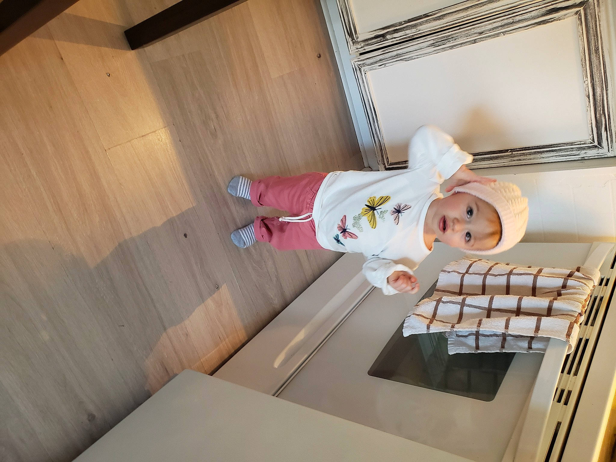 Maddyson participe au concours pour gagner de l'argent avec cette photo : baby, ceiling, child, comfort, computer_keyboard, daylighting, drawer, floor, flooring, hardwood, hat, headwear, home_appliance, house, interior_design, person, plywood, room, smile, toddler
