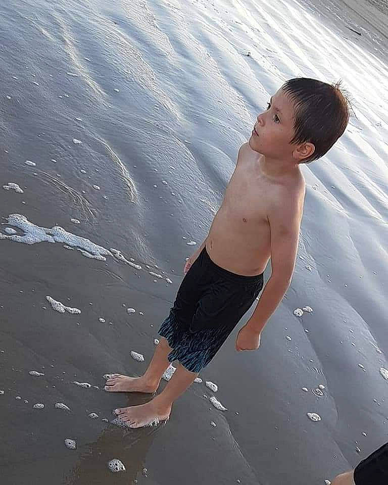 Tatum joined the competition — help win amazing prizes! arm, barechested, barefoot, beach, body_of_water, elbow, flash_photography, fun, hand, happy, human_body, landscape, leg, leisure, people_in_nature, people_on_beach, person, sand, sunlight, toddler