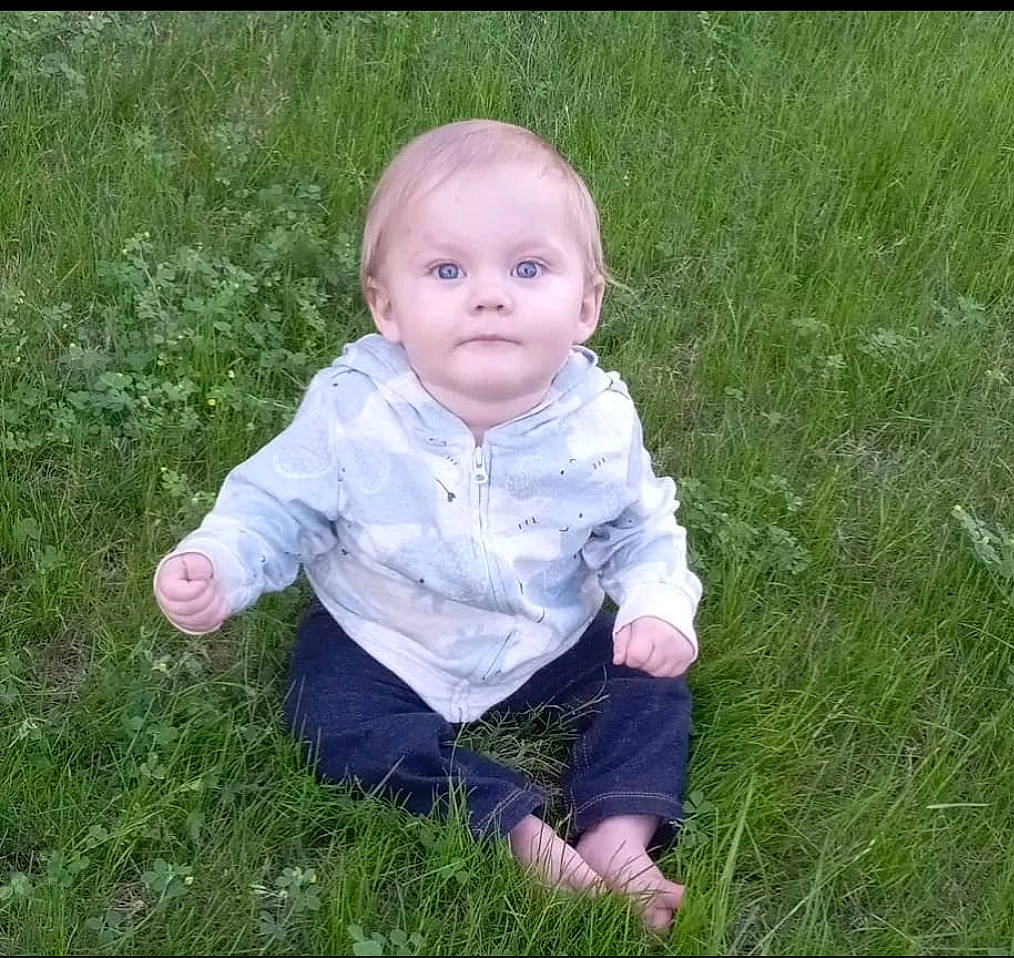 Braeson is registered to the contest to win money with this photo: baby, baby_toddler_clothing, child, fun, grass, grass_family, grassland, happy, lawn, meadow, pattern, people_in_nature, person, plant, portrait_photography, prairie, sitting, sleeve, toddler, yard
