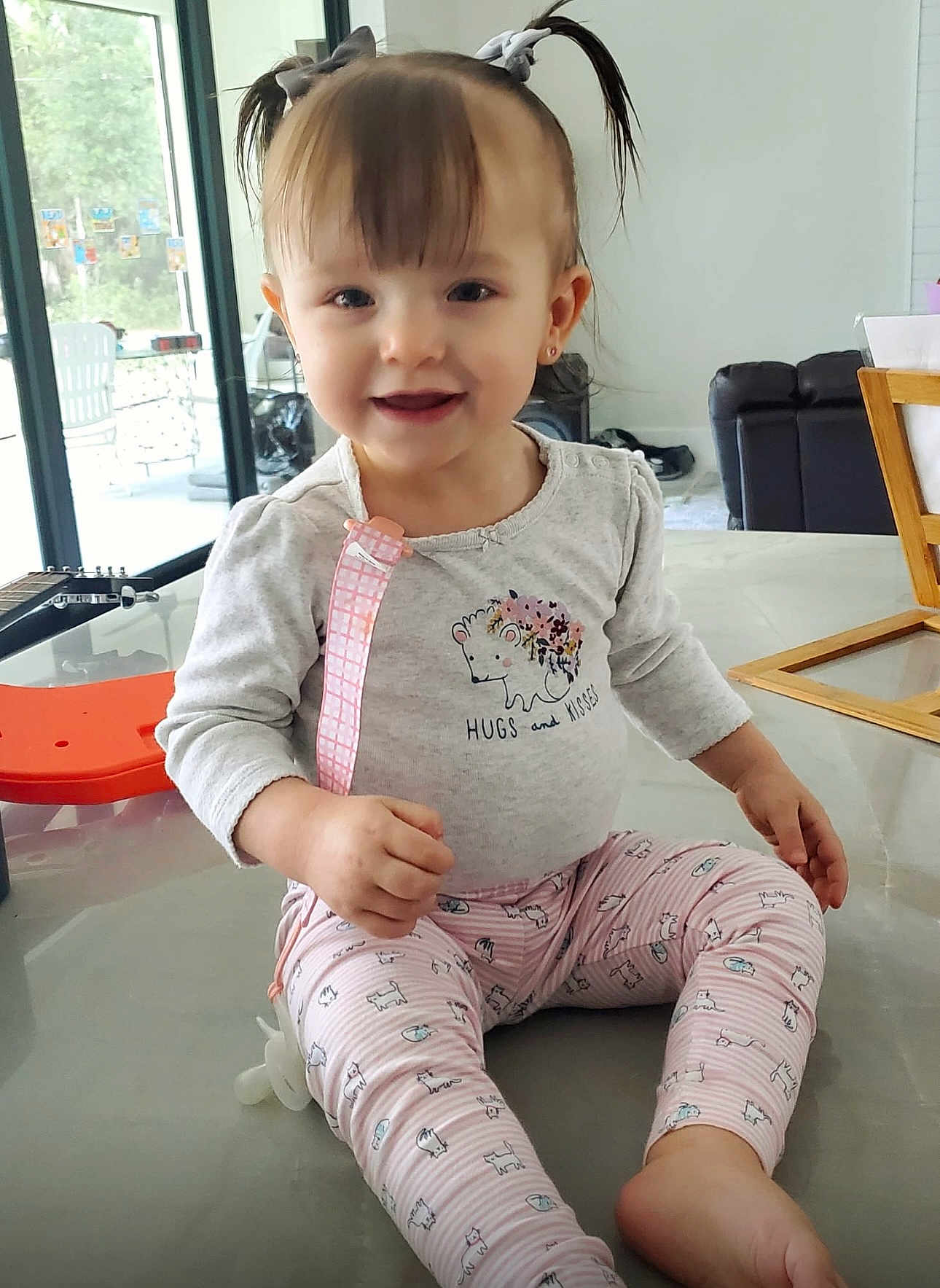 Sophia joined the competition — help win amazing prizes! bodypart, child, clothing, face, female, finger, furniture, girl, hair, hand, happy, head, pajamas, pants, person, photography, portrait, sitting, sleeve, smile