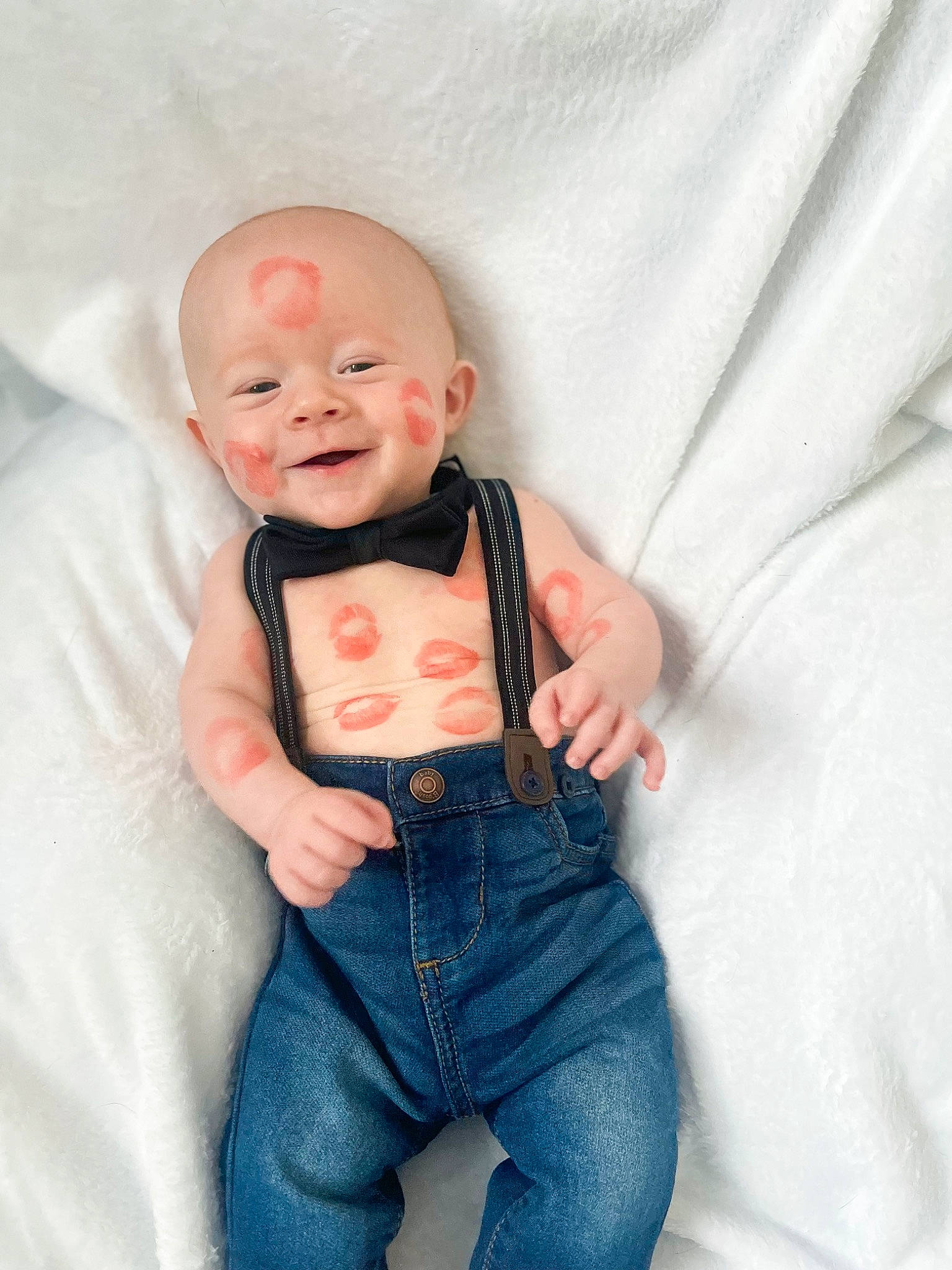 Harlow is registered to the contest to win money with this photo: arm, baby, baby_toddler_clothing, child, comfort, eye, finger, flash_photography, gesture, hand, happy, head, nose, orange, person, skin, sleeve, smile, t_shirt, textile