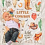 arrow, baby, bandana, blanket, boots, cactus, child, clothing, cowboy, cowboy_hat, cute, horseshoe, infant, jeans, lying_down, portrait, skull, western_theme, white_shirt, wild_and_free