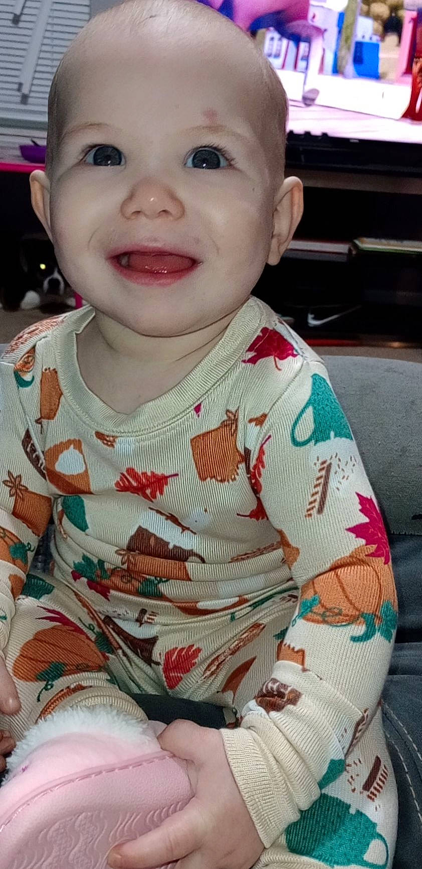 Hazel Grace is registered to the contest to win money with this photo: baby, baby_laughing, baby_toddler_clothing, cheek, child, comfort, creative_arts, eyebrow, eyelash, happy, iris, joy, lip, nose, pattern, person, pink, sitting, skin, sleeve