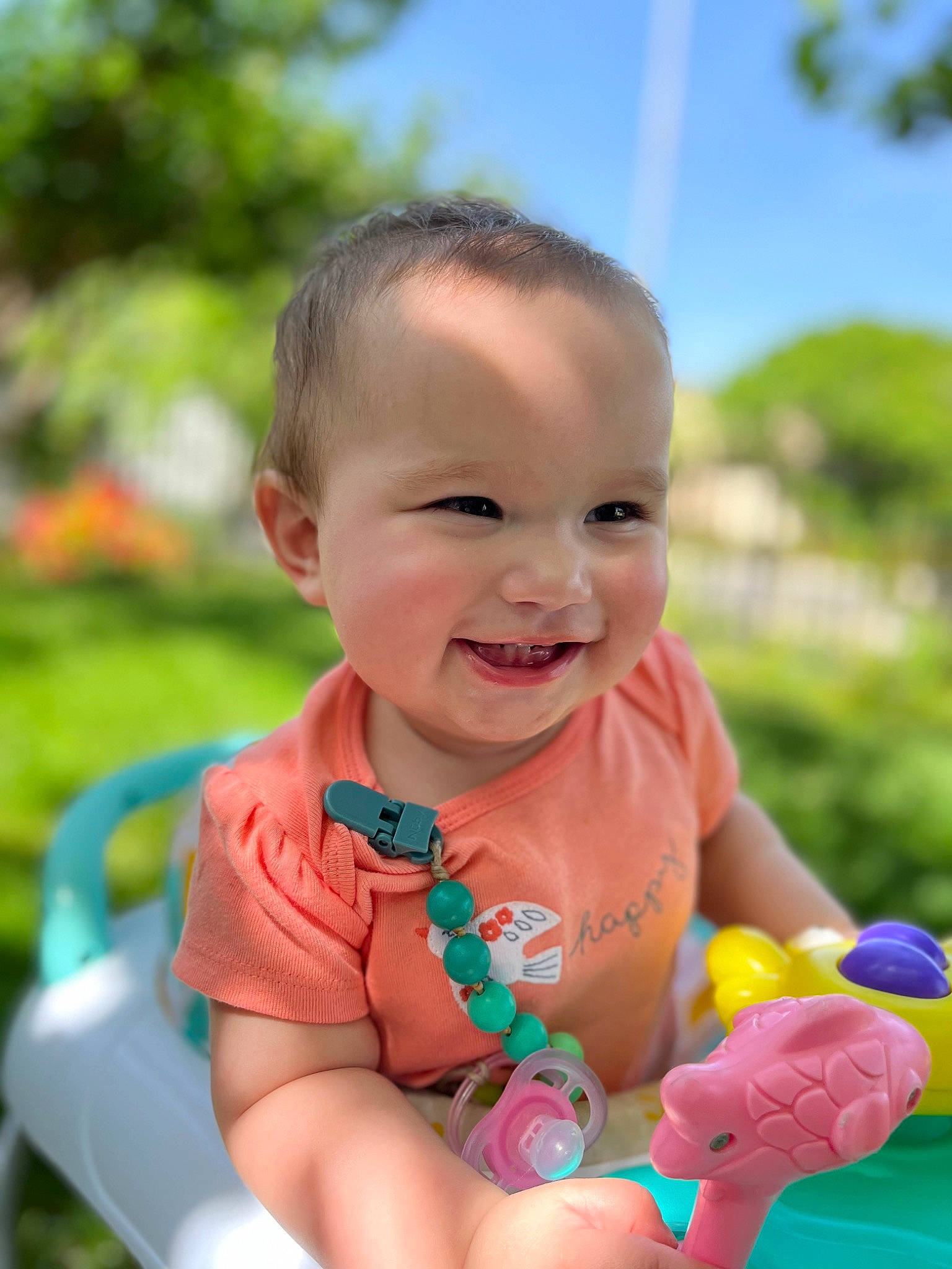 Magnolia is registered to the contest to win money with this photo: baby, baby_toddler_clothing, child, facial_expression, finger, fun, gesture, grass, happy, joy, leisure, people_in_nature, person, pink, plant, recreation, skin, sky, smile, summer