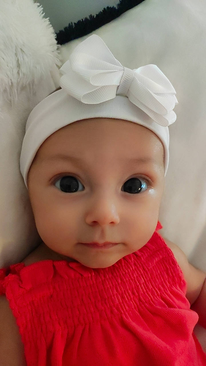 Kiara a rejoint le concours — aidez-le/la à gagner de superbes lots ! baby_toddler_clothing, beauty, cap, cheek, child, chin, costume_hat, doll, dress, eyebrow, eyelash, facial_expression, headgear, headwear, lip, organ, person, pink, skin, toddler