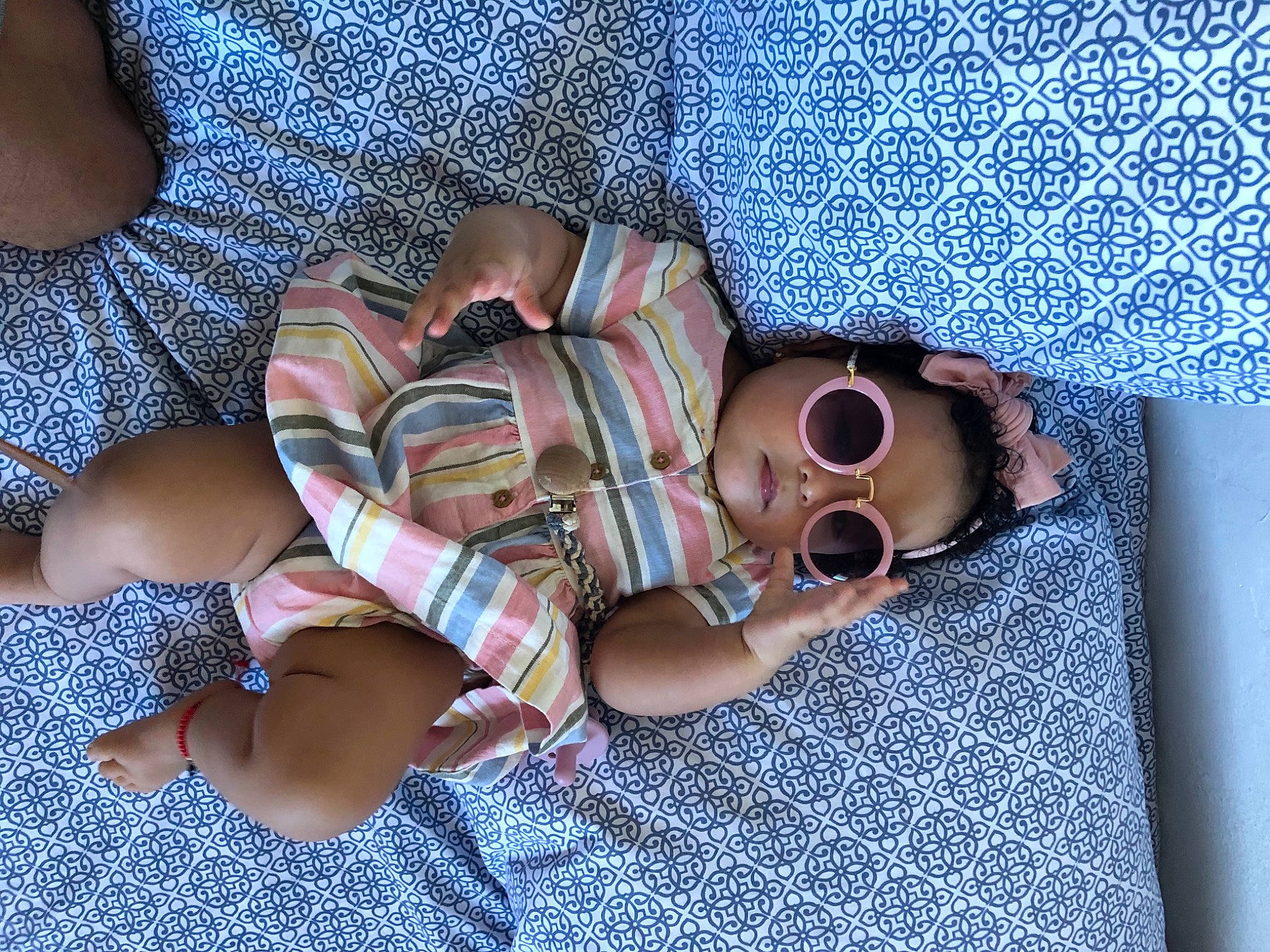 Kinsley is registered to the contest to win money with this photo: baby_toddler_clothing, comfort, electric_blue, eyewear, fashion_accessory, finger, foot, goggles, human_leg, linens, nail, pattern, person, plaid, purple, sleeve, street_fashion, sunglasses, thigh, toe