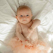 Anna-Lia participe au concours pour gagner de l'argent avec cette photo : baby, infant, tutu, blanket, soft, cute, child, portrait, lying_down, skin, expression, newborn, adorable, clothing, tulle, person, indoors, sleepwear, resting, peaceful
