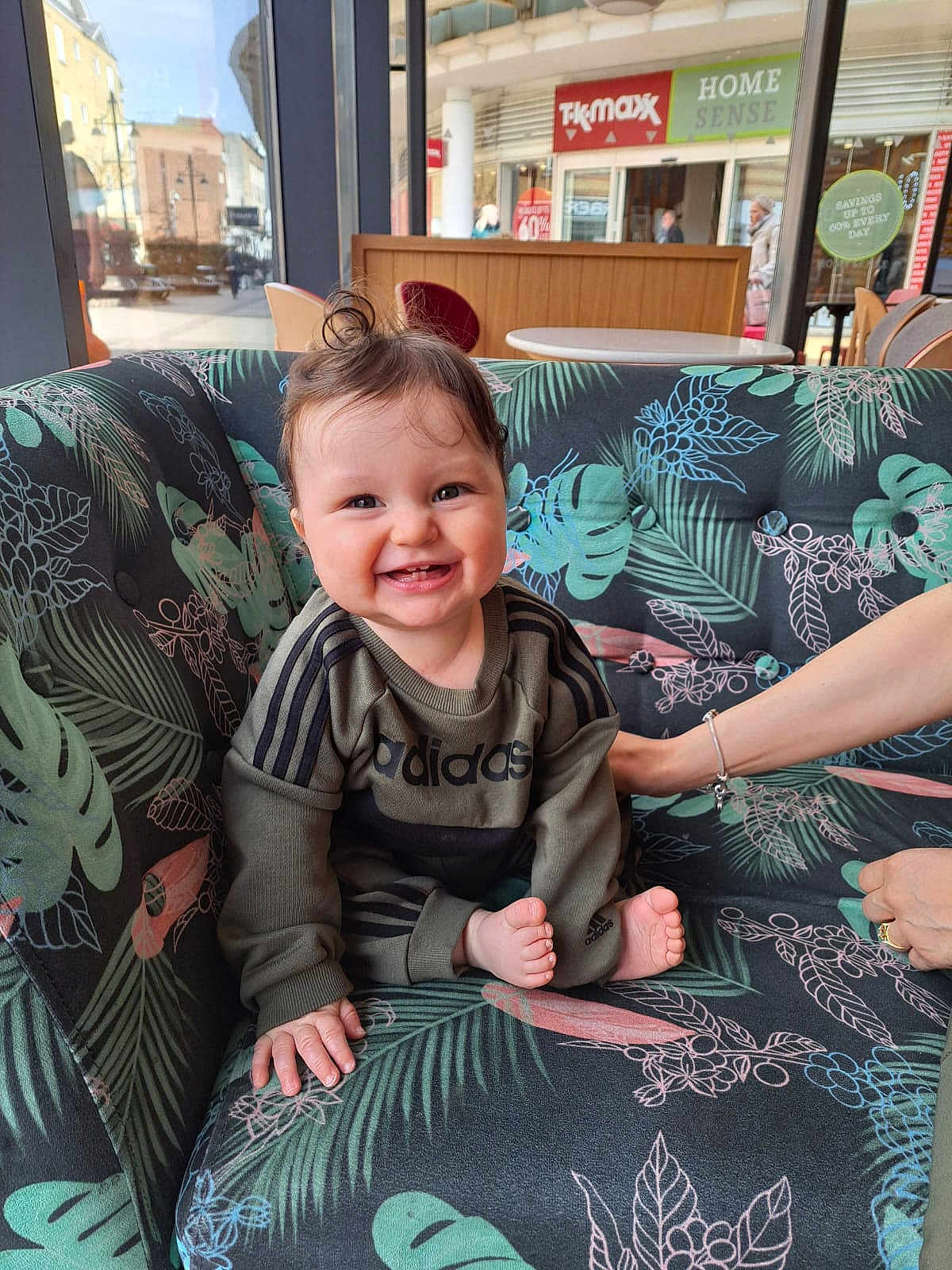 Noah joined the competition — help win amazing prizes! baby, smiling, cute, indoor, couch, floral_pattern, happy, person, child, clothing, hand, window, light, hair, foot, seated, support, interior, adidas, tooth