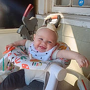 Abigail joined the competition — help win amazing prizes! baby, smile, headband, baby_walker, indoor, sunlight, window, toy, happy, infant, clothing, seat, person, child, foot, arm, face, playful, home, relax