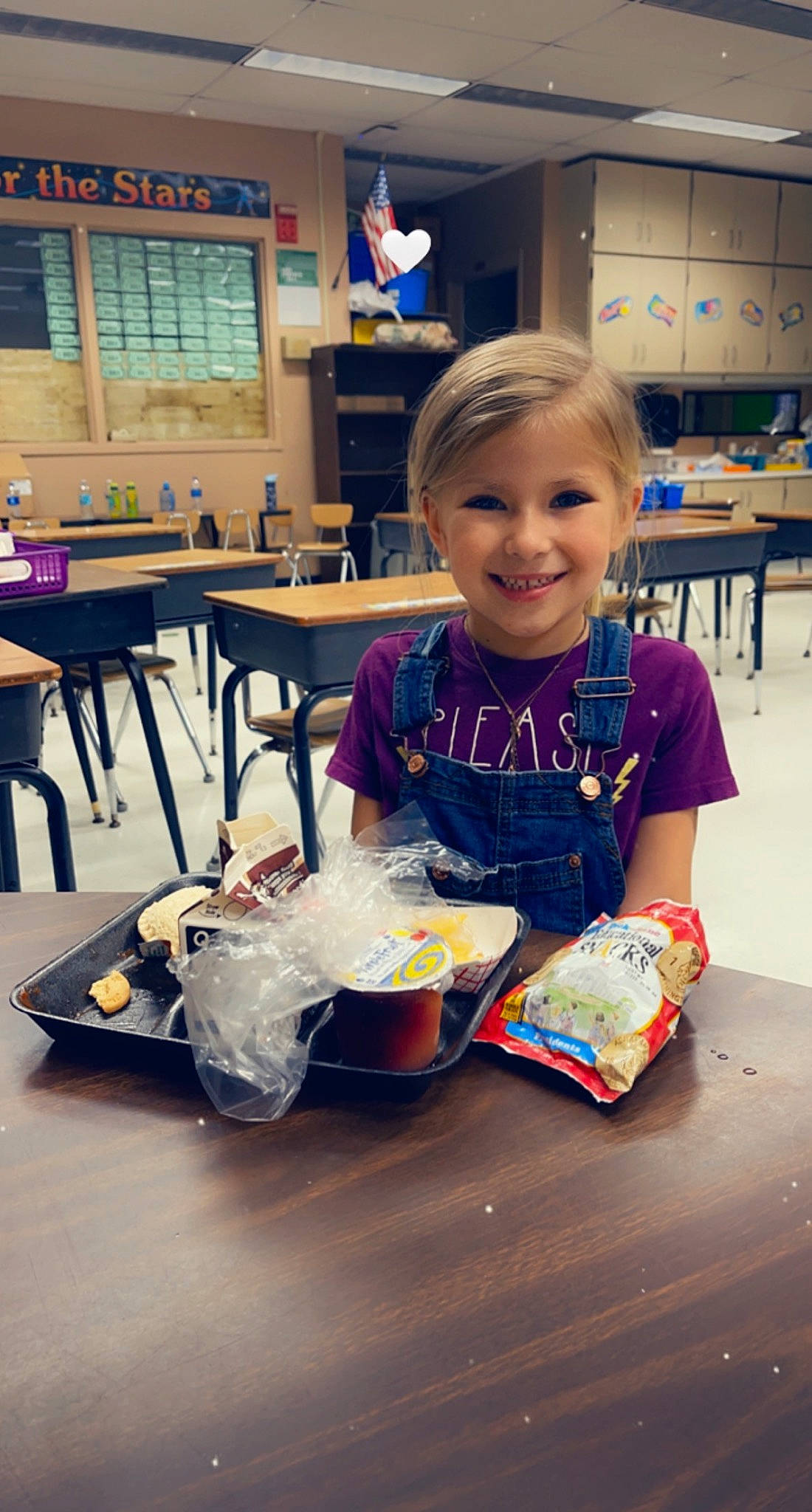 Katherine is registered to the contest to win money with this photo: chair, child, comfort_food, cuisine, flooring, food, fun, happy, joy, junk_food, learning, leisure, meal, person, play, recreation, room, sitting, smile, table