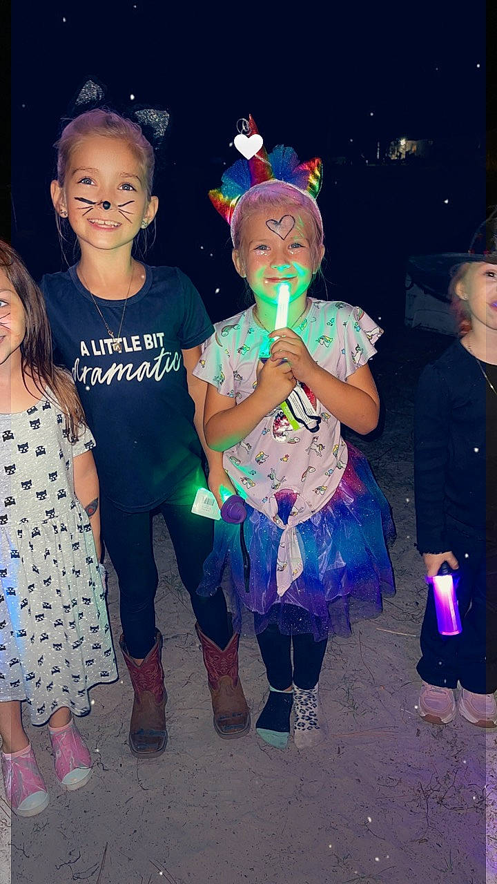 Katherine is registered to the contest to win money with this photo: boot, child, cool, costume, electric_blue, entertainment, event, fashion_accessory, fashion_design, fun, happy, head, joy, party_supply, performing_arts, person, pink, purple, sandal, smile