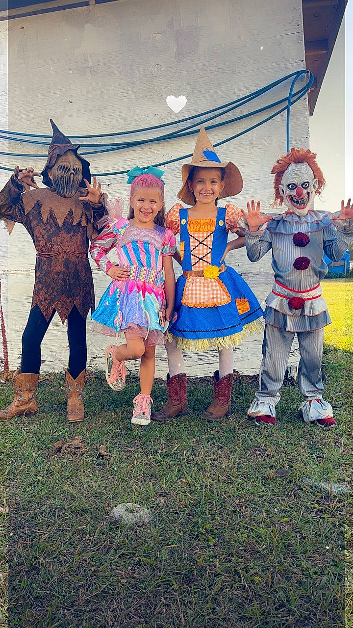 Katherine joined the competition — help win amazing prizes! art, boot, child, costume, event, fictional_character, footwear, fun, grass, happy, hat, headwear, joy, leisure, party_supply, person, recreation, shorts, team, toddler