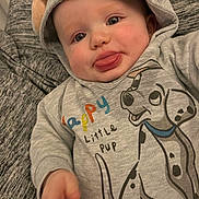 Matteo Peter Noel joined the competition — help win amazing prizes! baby, child, hoodie, tongue_out, cute, clothing, cartoon, dog, grey, smiling, face, infant, apparel, sleeve, hand, person, playful, young, portrait, fabric
