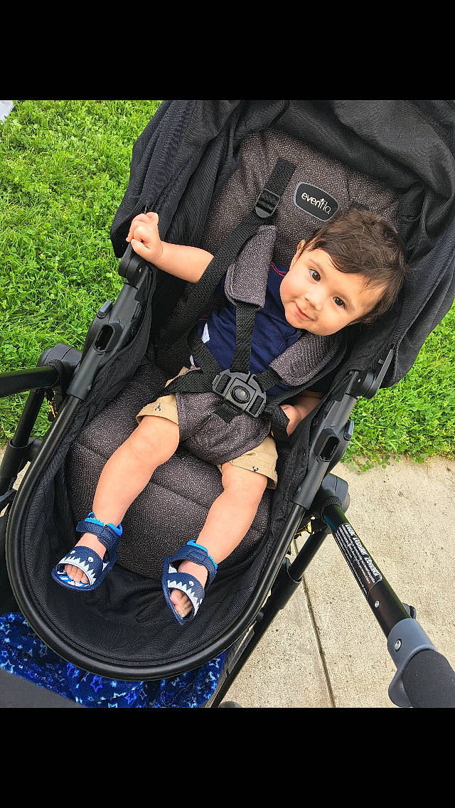 Alfred is registered to the contest to win money with this photo: baby, baby_carriage, baby_products, black_hair, child, leg, person, photography, plant, play, product, recreation, sitting, smile, tree