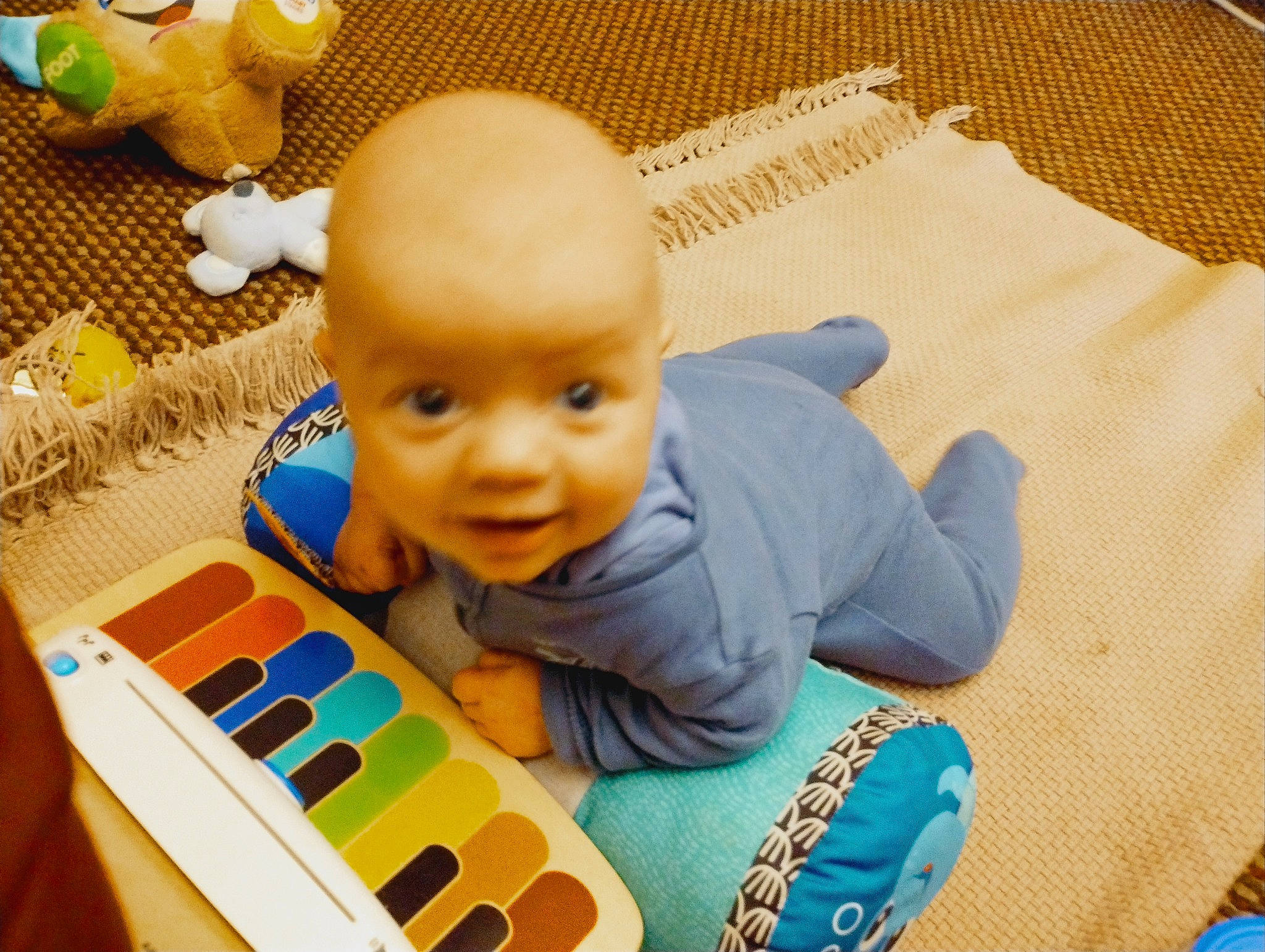 George is registered to the contest to win money with this photo: art, baby, baby_products, baby_safety, baby_toddler_clothing, baby_toys, child, comfort, flooring, fun, green, happy, linens, mammal, person, room, smile, textile, toddler, toy