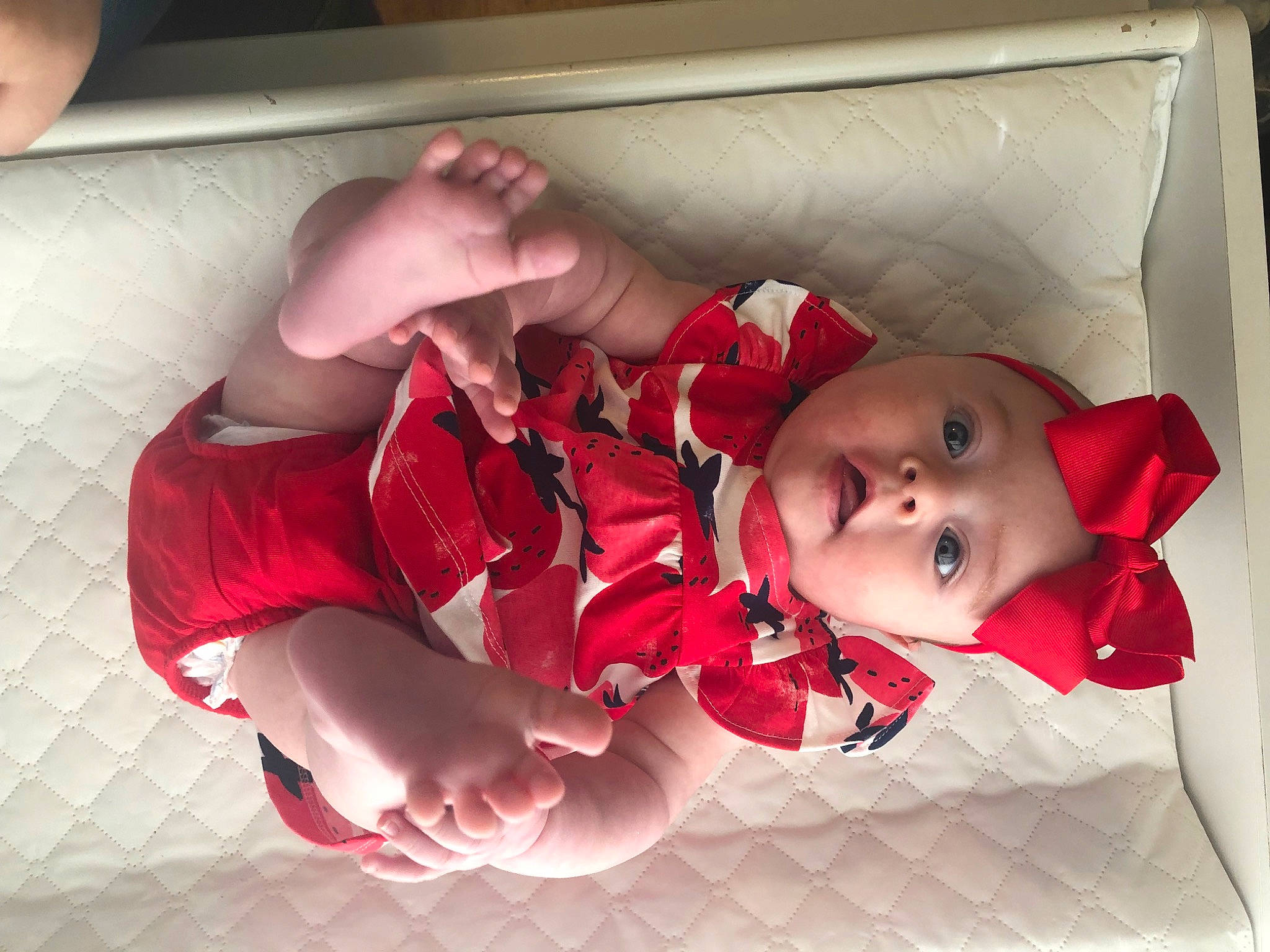 Cayson joined the competition — help win amazing prizes! baby, baby_products, baby_toddler_clothing, carmine, child, comfort, foot, fun, headwear, human_leg, knee, linens, mouth, pattern, person, pink, plaid, room, sitting, sock