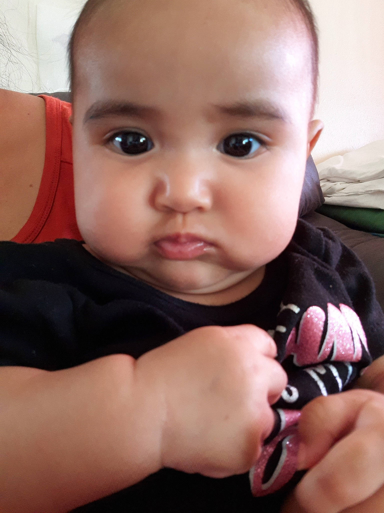 Anika is registered to the contest to win money with this photo: baby, cheek, child, eye, face, finger, hand, head, lip, mouth, muscle, nail, nose, person, skin, smile, thumb, toddler