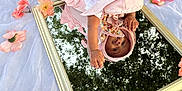 Sianni is registered to the contest to win money with this photo: baby, clothing, dress, face, fashion, flower, flowerarrangement, flowerbouquet, formalwear, geranium, gown, hat, head, leaf, person, petal, photography, plant, portrait, rose