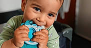 Kevin joined the competition — help win amazing prizes! baby, casual, chewing, child, closeup, clothing, cute, face, furniture, hands, happy, indoor, person, playpen, room, smiling, teething_toy, toddler, toy, young_child