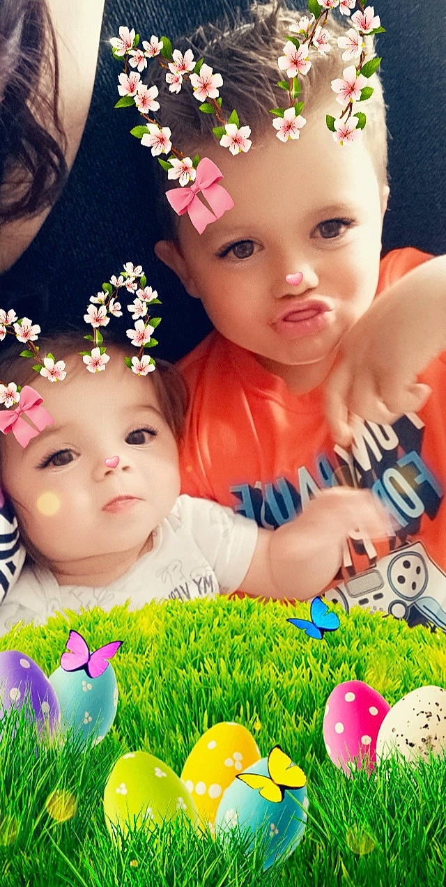 Kacey is registered to the contest to win money with this photo: baby, baby_toddler_clothing, cheek, eye, facial_expression, flower, grass, green, hairstyle, happy, headwear, iris, organ, people_in_nature, person, petal, photograph, pink, product, skin