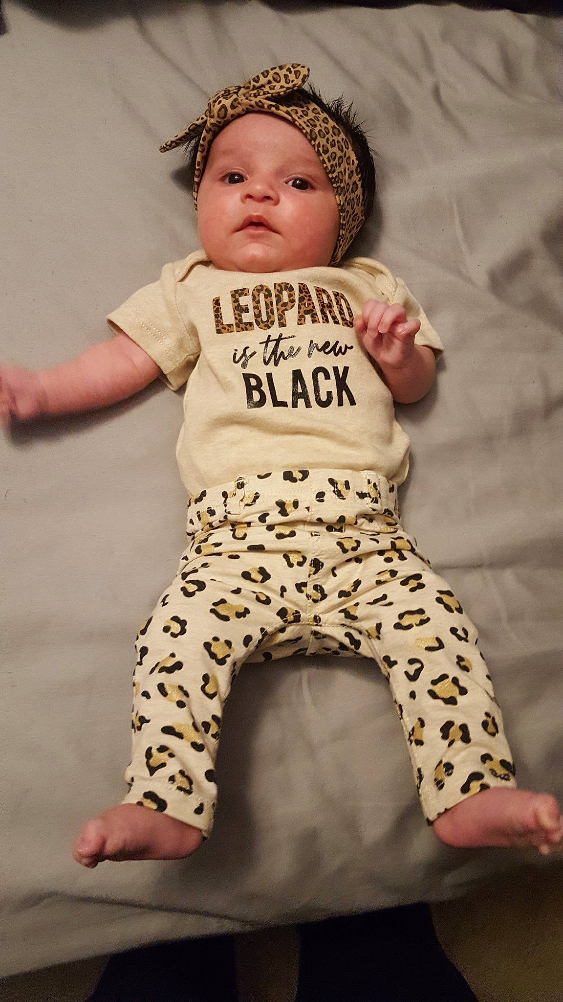 Kota is registered to the contest to win money with this photo: baby, baby_toddler_clothing, child, headwear, pattern, person, sleeve, t_shirt, toddler