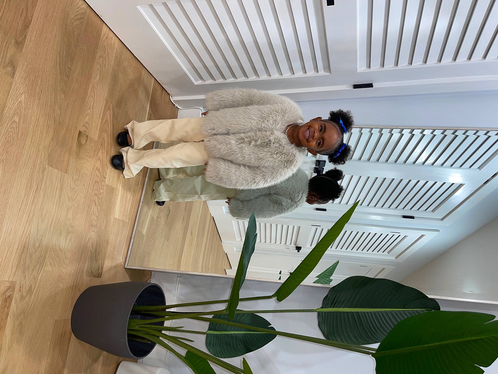 Kali is registered to the contest to win money with this photo: building, ceiling, chair, comfort, daylighting, flooring, flowering_plant, glass, hardwood, hat, joy, line, metal, pattern, person, plant, plant_stem, room, tree, white