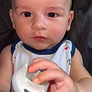 Bobby joined the competition — help win amazing prizes! baby, infant, child, pacifier, hand, face, eyes, skin, clothing, sleeveless, curious, cute, portrait, indoors, closeup, expression, young, person, fingernails, background