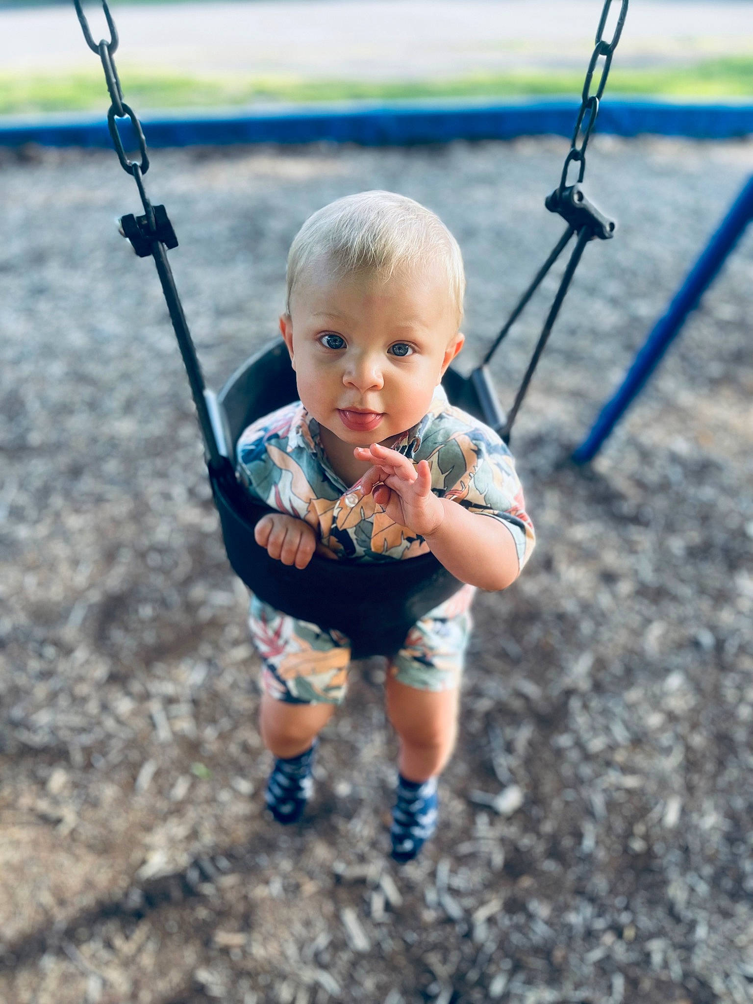Timothy is registered to the contest to win money with this photo: azure, baby, baby_toddler_clothing, body_of_water, child, city, electric_blue, fun, grass, happy, leisure, outdoor_play_equipment, people_in_nature, person, photograph, play, playground, recreation, smile, swing