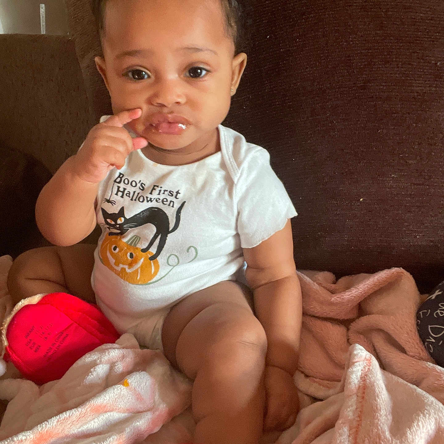 Brailynn is registered to the contest to win money with this photo: baby, bodypart, clothing, couch, cutlery, eating, face, finger, food, furniture, hand, happy, head, person, photography, portrait, shorts, sitting, smile, t_shirt