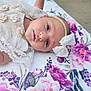 accessories, baby, bed, bodypart, bonnet, clothing, dress, face, finger, flower, furniture, hand, hat, head, newborn, pattern, person, photography, plant, portrait