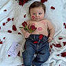Isaïe participe au concours pour gagner de l'argent avec cette photo : baby, blanket, bouquet, cheeks, child, denim, flower, hand, infant, jeans, kiss_marks, lips_mark, lying_down, milestone_card, portrait, red_roses, rose_petals, socks, soft_texture, three_months