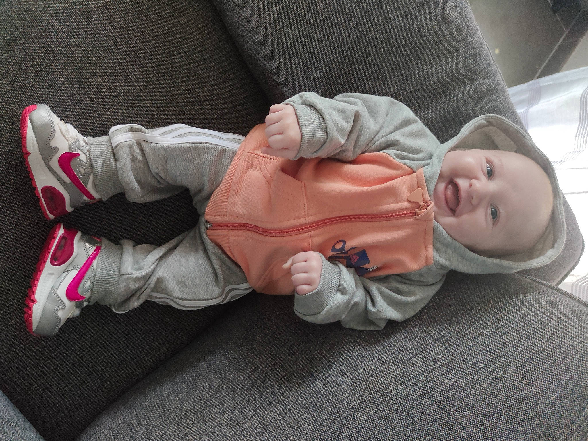 Katalya participe au concours pour gagner de l'argent avec cette photo : baby, baby_carriage, baby_products, baby_toddler_clothing, carmine, cheek, child, comfort, flooring, grass, headwear, leg, linens, person, plant, sitting, sleeve, textile, toddler, tree