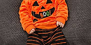Jeremy joined the competition — help win amazing prizes! baby, infant, pumpkin_costume, orange_clothing, green_socks, striped_pants, hat, blanket, milestone_sign, three_months, smiling, face, cute, lying_down, indoors, child, portrait, seasonal, holiday, cozy
