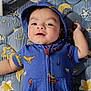 Jeremy joined the competition — help win amazing prizes! baby, infant, blue_onesie, dinosaur_print, smiling, lying_down, baby_einstein, toy_piano, colorful, stars_pattern, moon_pattern, baby_mat, cute, child, hooded_outfit, indoor, playtime, happy, face, young_child