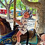 Joel Hernandez is registered to the contest to win money with this photo: toddler, child, carousel, carousel_horse, hat, bucket_hat, smiling, outdoor, daylight, playground, trees, clothing, shoes, nike, sneakers, fun, happy, amusement_park, ride, person