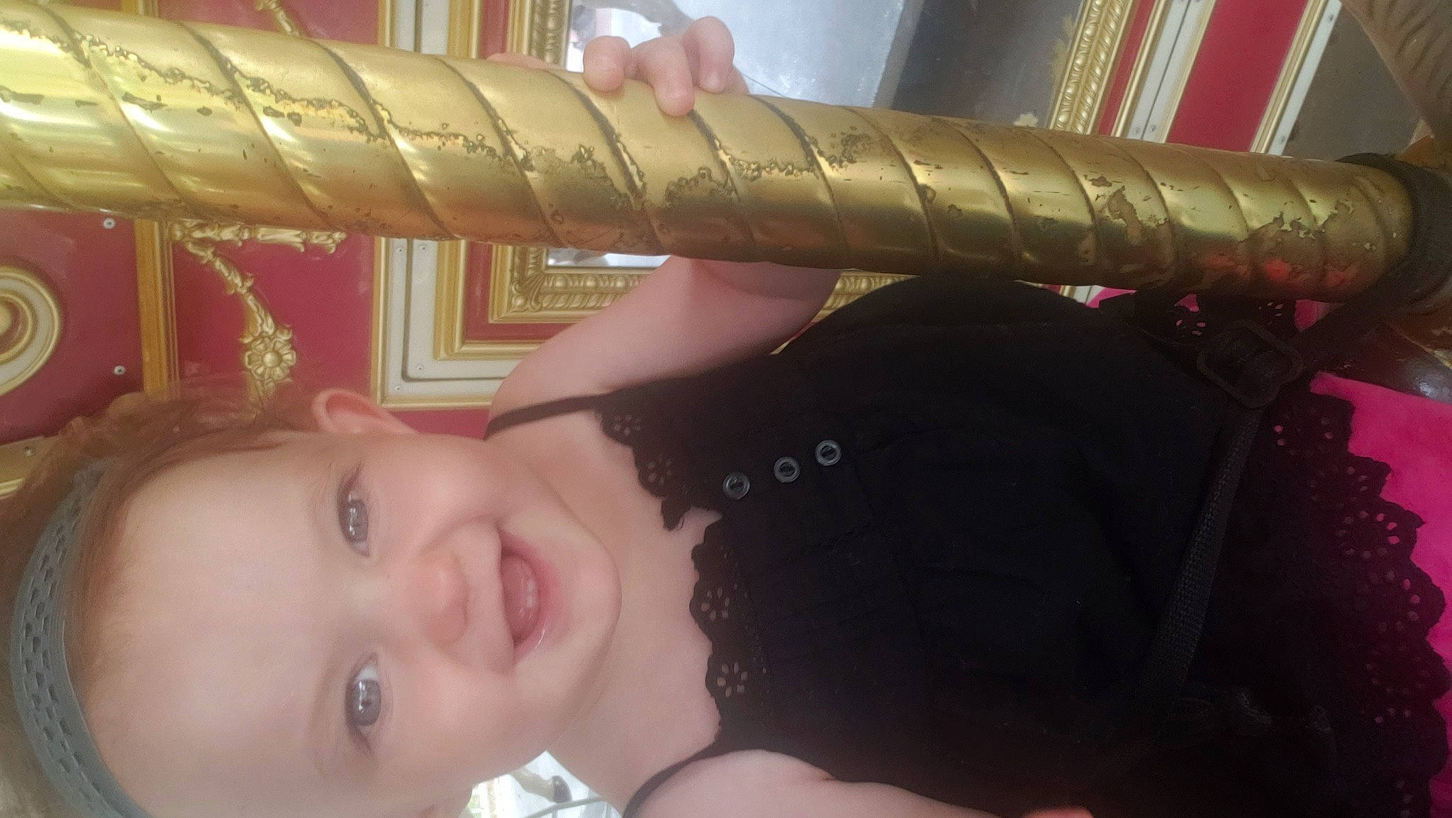 Phoebe is registered to the contest to win money with this photo: baby, black_hair, cheek, child, ear, eye, face, finger, forehead, hand, head, joy, lip, mouth, neck, nose, person, pink, selfie, skin