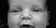 Marius a rejoint le concours — aidez-le/la à gagner de superbes lots ! baby, close_up, black_and_white, face, infant, smiling, happy, expression, portrait, child, cute, young, apparel, sitting, head, skin, eyes, mouth, indoors, person