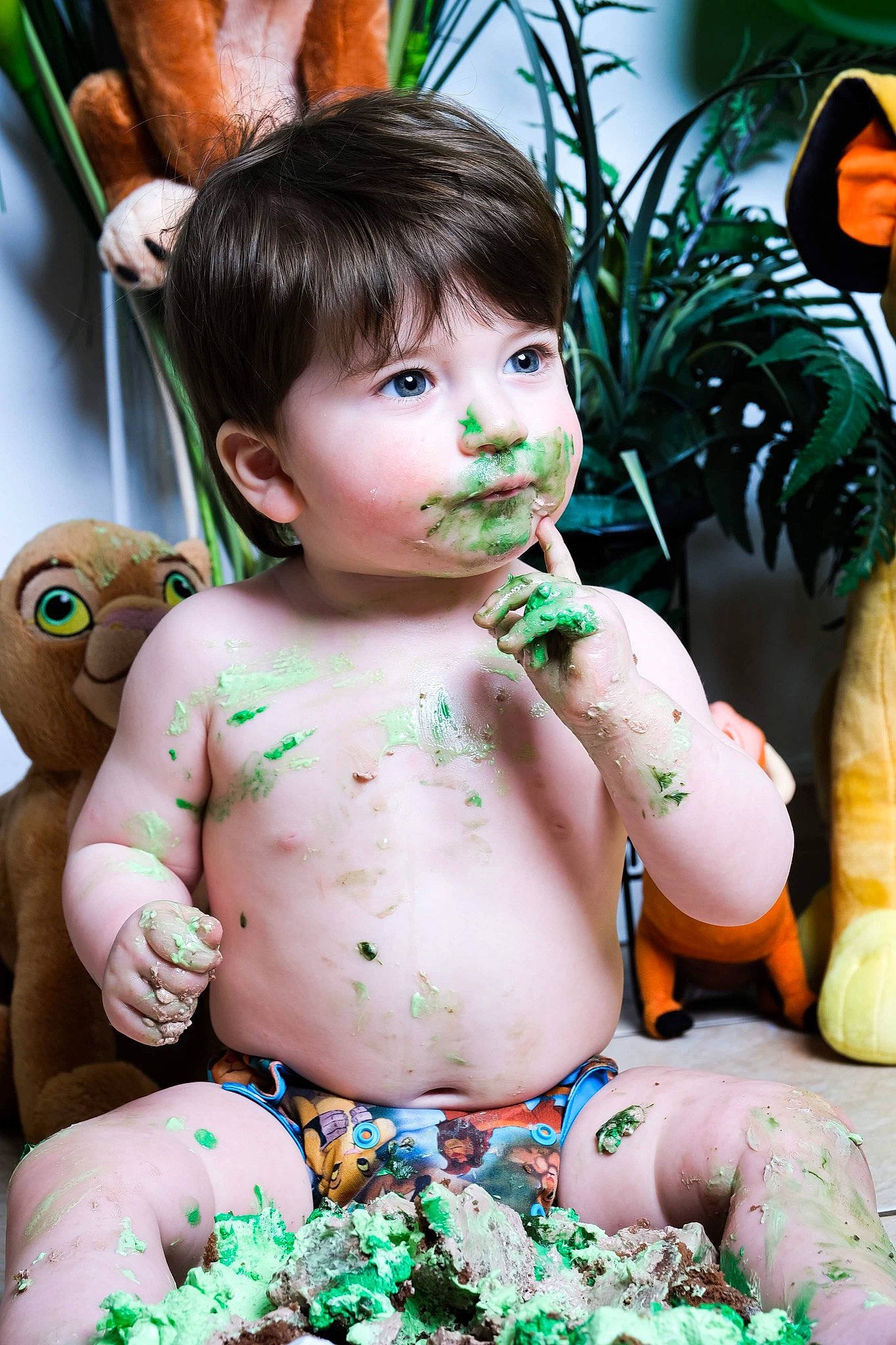 Jake participe au concours pour gagner de l'argent avec cette photo : abdomen, cheek, chest, child, doll, facial_expression, grass, green, happy, houseplant, leisure, navel, person, plant, sitting, skin, stuffed_toy, sweetness, toddler, toy