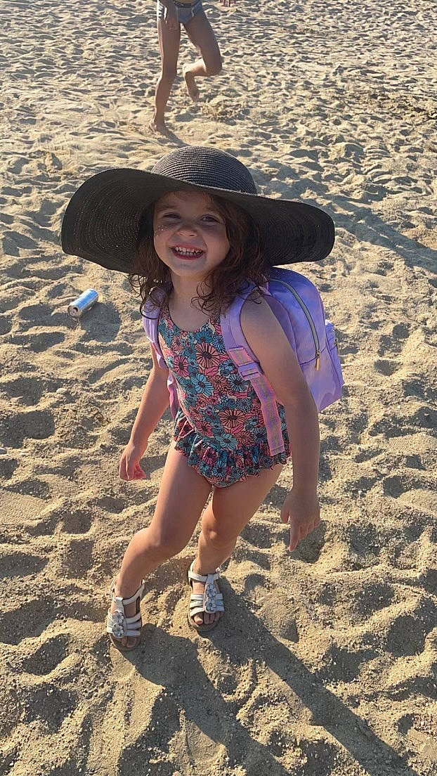 Chelsea participe au concours pour gagner de l'argent avec cette photo : azure, beach, body_of_water, cool, electric_blue, fun, happy, hat, headgear, headwear, joy, landscape, leisure, light, people_in_nature, person, sand, smile, summer, sun_hat