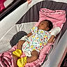 Layla is registered to the contest to win money with this photo: newborn, baby, sleeping, bassinet, blanket, pink, mittens, booties, onesie, infant, cozy, soft, cute, child, resting, indoors, bed, fabric, colorful, peaceful