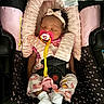 Layla joined the competition — help win amazing prizes! baby, sleeping, car_seat, pacifier, headband, pink, clothing, socks, infant, child, cute, patterned_pants, soft_padding, clip, straps, safety_buckle, indoors, peaceful, resting, toddler