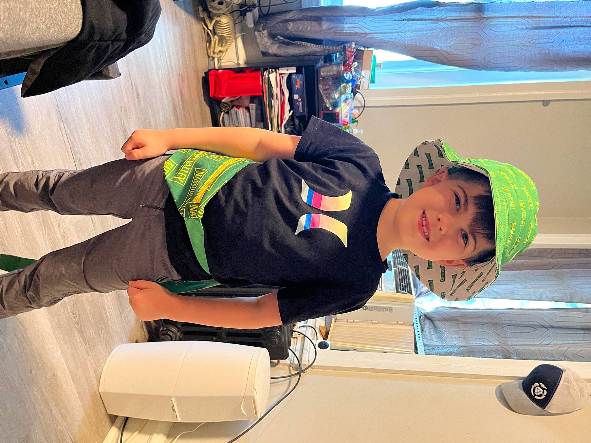 Daniel is registered to the contest to win money with this photo: baseball_cap, boats_and_boating_equipment_and_supplies, cap, elbow, electric_blue, fun, hat, human_leg, joy, knee, leisure, person, personal_protective_equipment, recreation, smile, sportswear, sunglasses, thigh, tire, vacation