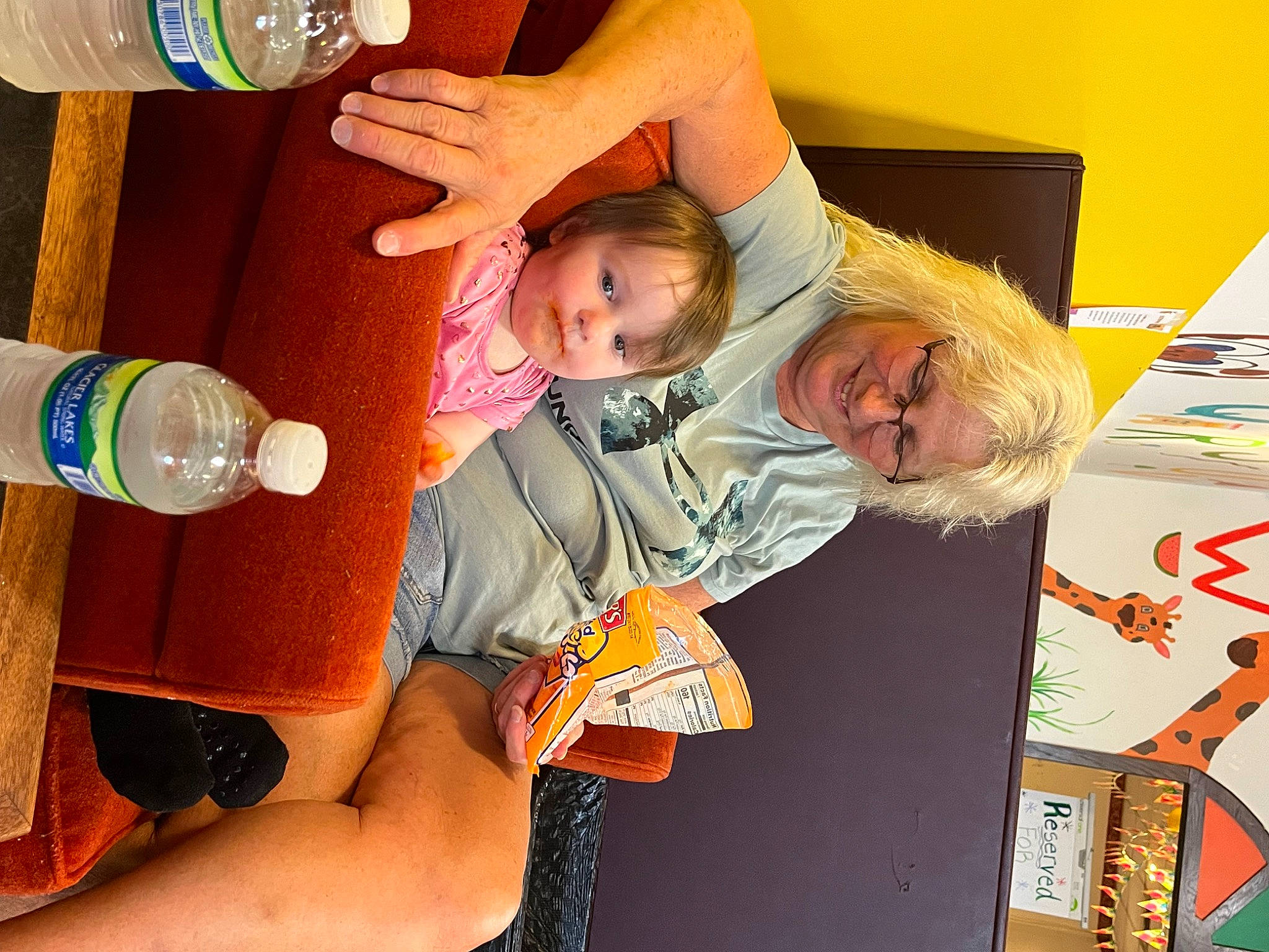 Delilah is registered to the contest to win money with this photo: art, bottle, bottled_water, child, drink, drinking, drinking_water, drinkware, event, finger, fun, hand, happy, joy, mineral_water, person, plastic_bottle, room, smile, toddler