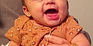 Ziya joined the competition — help win amazing prizes! baby, child, smiling, jewelry, bracelets, necklace, hands, person, indoor, cute, happy, clothing, patterned_shirt, peach_pants, infant, portrait, human, young_child, accessories, holding