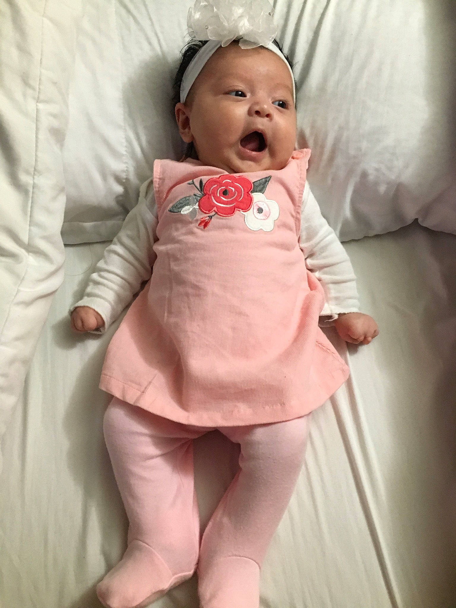 Selena is registered to the contest to win money with this photo: baby, baby_toddler_clothing, cheek, child, daughter, lip, person, pink, skin, smile, toddler